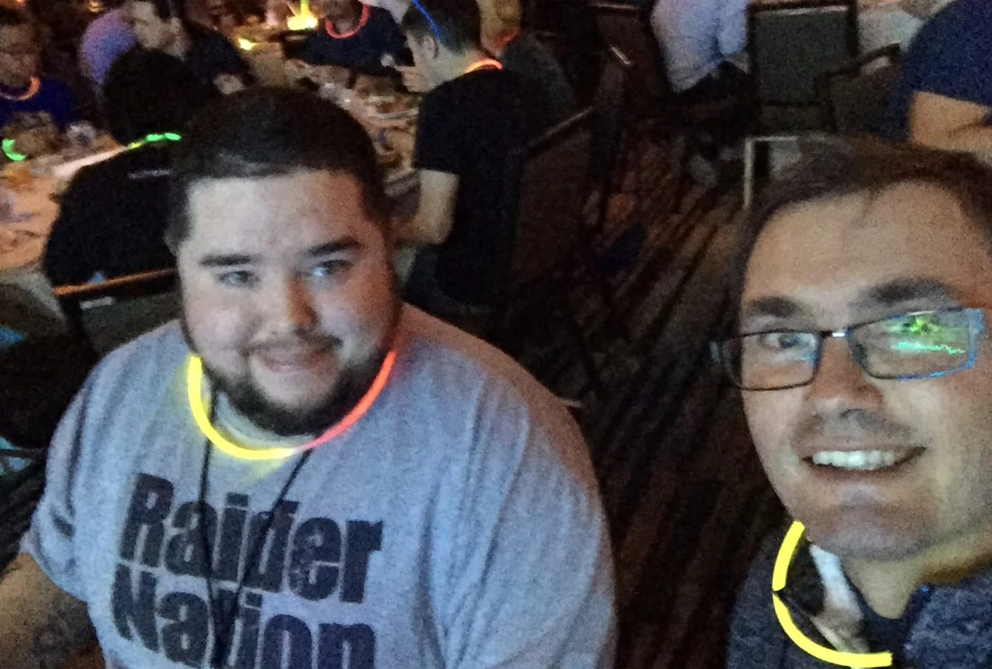 Eric Binnion and me at an Automattic meetup, both wearing glow sticks